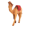Image of Toy camel figure with a red saddle on a white background